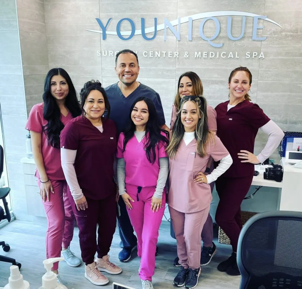 Team of medical professionals at a plastic surgery center in branded scrubs.