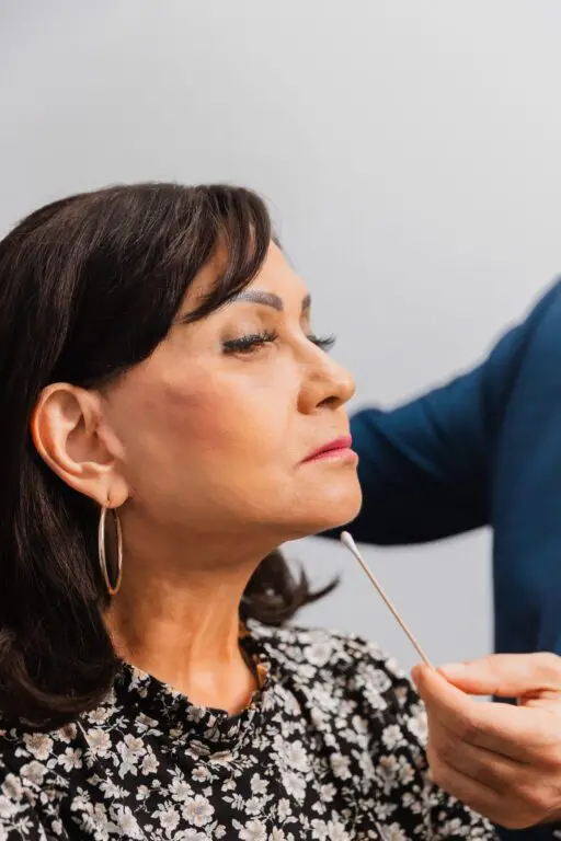 Woman receiving a cosmetic consultation at a plastic surgery center.
