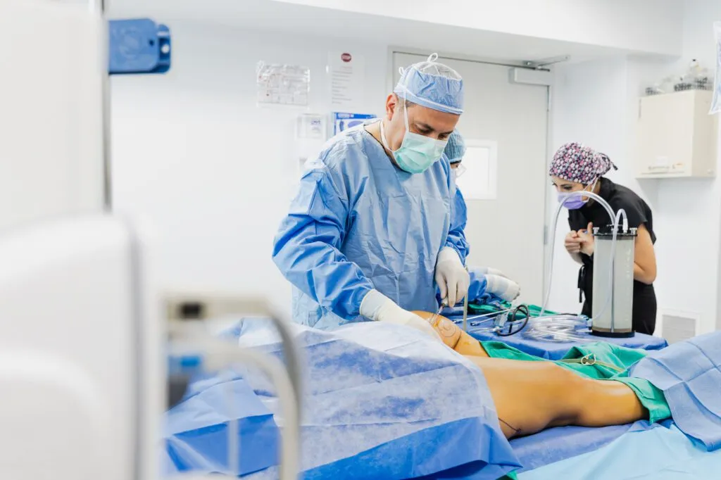 Surgeons performing a procedure in a plastic surgery operating room.