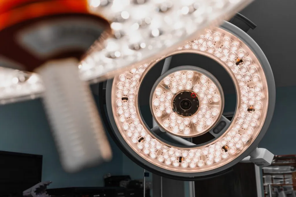 Surgical operating room light fixture with circular LED arrangement.