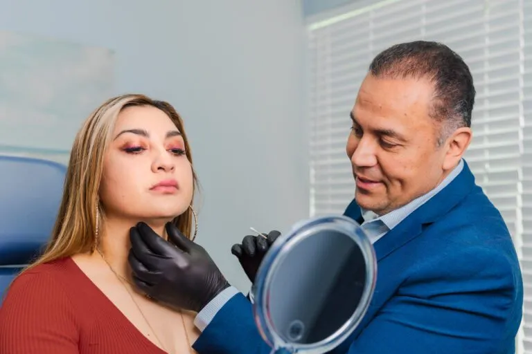 Plastic surgeon consulting with patient for cosmetic procedure.