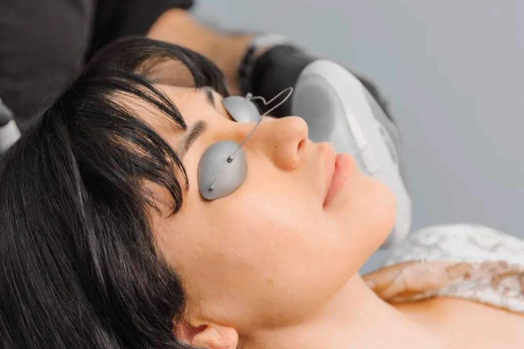 Patient receiving laser treatment at a plastic surgery center.